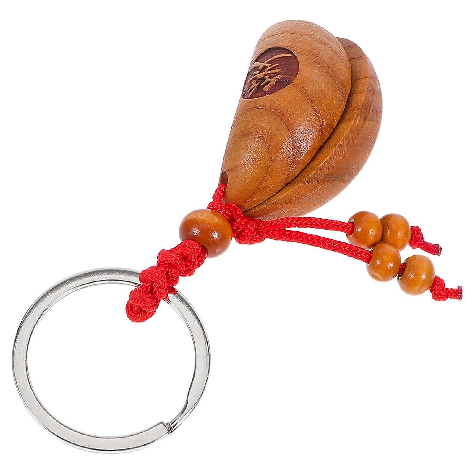 The **Sacred Gua Cup Keychain** is a unique and meaningful accessory rooted in traditional **Taoist and Feng Shui** practices. This vintage style