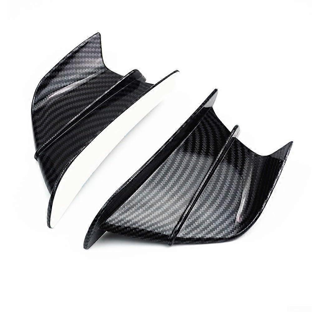 Carbon fiber spoiler for Ducati motorcycles to improve aerodynamics and stability.