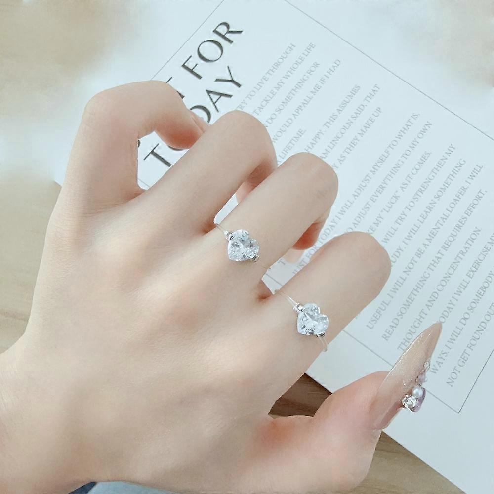 Bague classique et élégante en acier inoxydable avec zircon brillant et ligne invisible, ornée d'une ligne géométrique circulaire. Bijou de mariage pour femme.