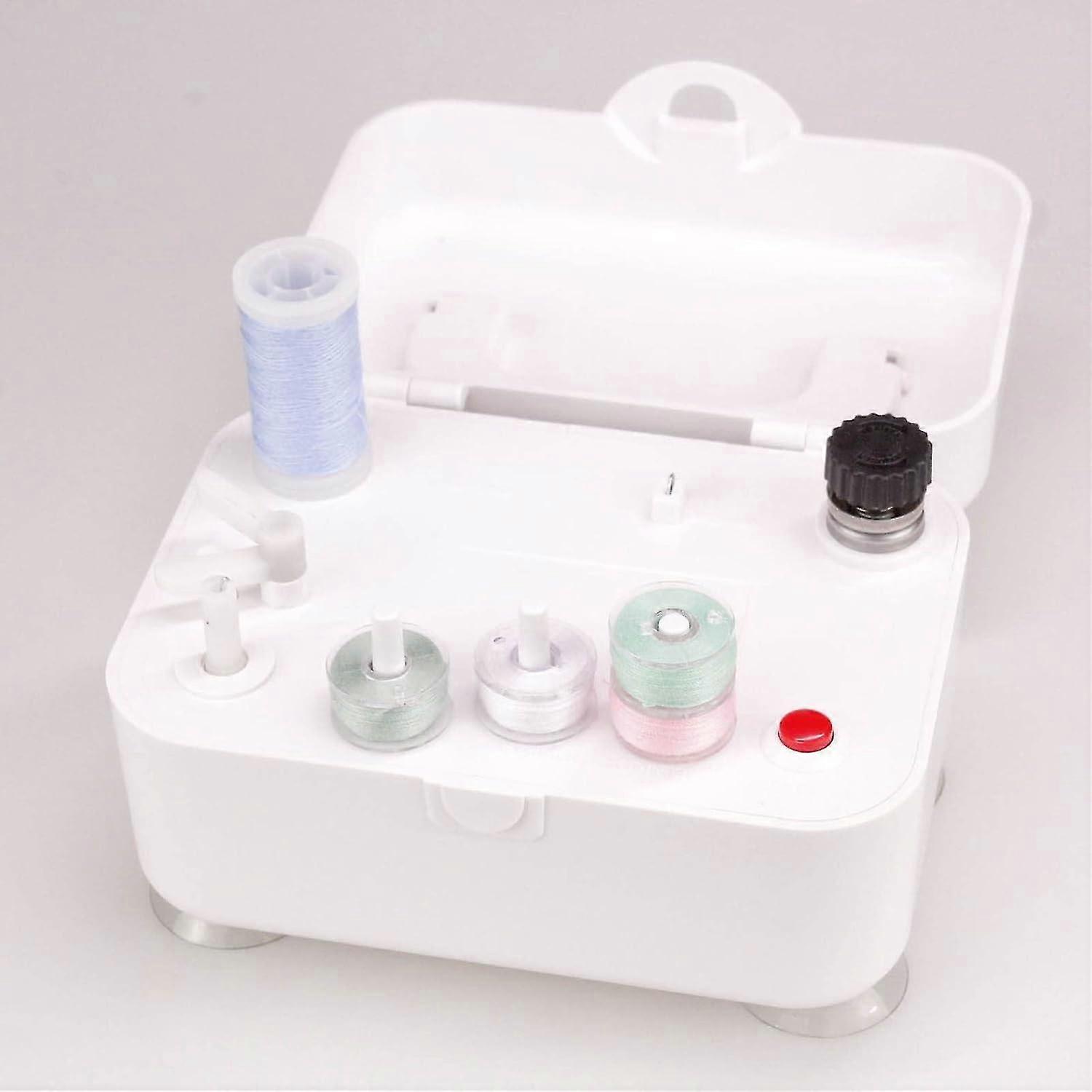 Electric bobbin winder for sewing machines, powered by 5VDC or 2 AA batteries, with latch, suction cup, 2 bobbin retention configuration and built-in