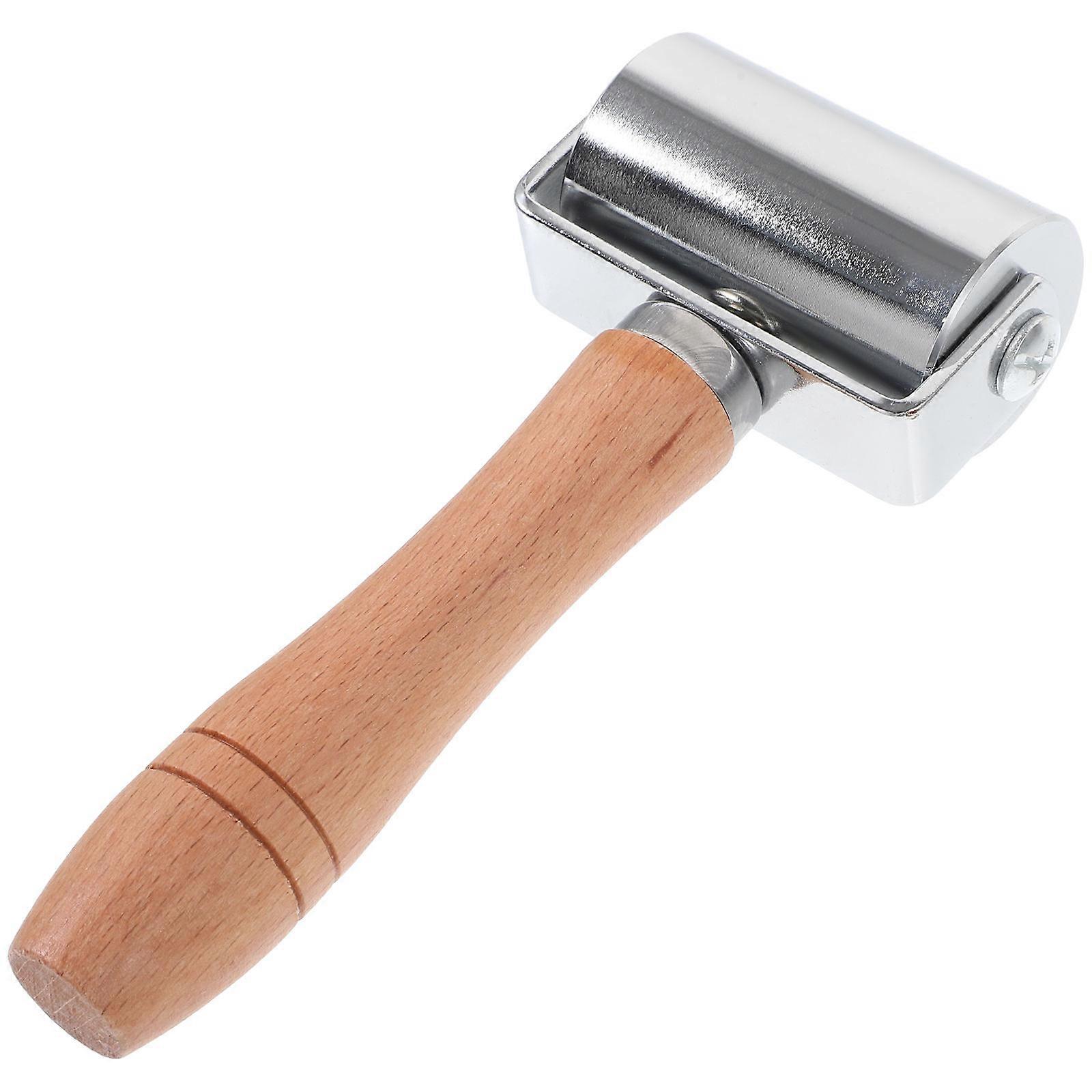 The ** Craft Seam Roller** is a , ergonomic handheld tool designed to assist in leatherworking, quilting, and bag or shoe making. It's used to apply