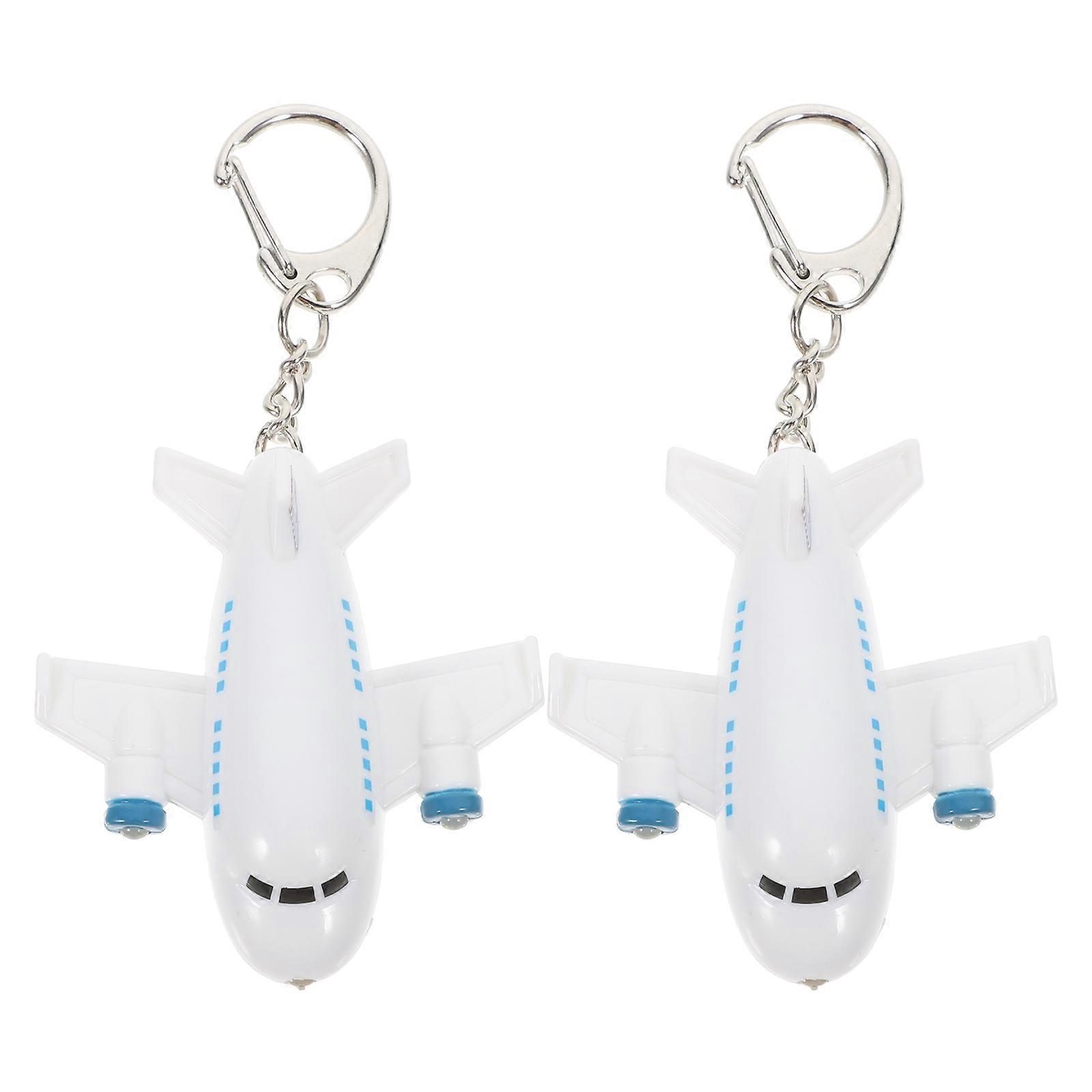 Travel inspired key decoration, robust airplane charm for utility and flair