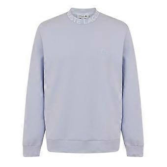 Lacoste miesten logolla varustettu pyöreäkauluksinen collegepaita