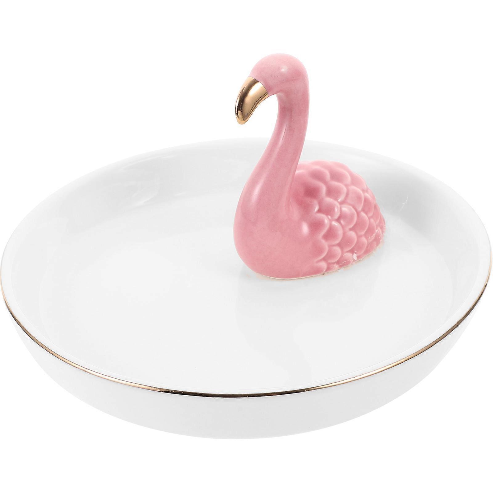 The **Flamingo Design Ceramic Jewelry Tray** is a charming and functional decorative piece designed to help organize and display your jewelry while