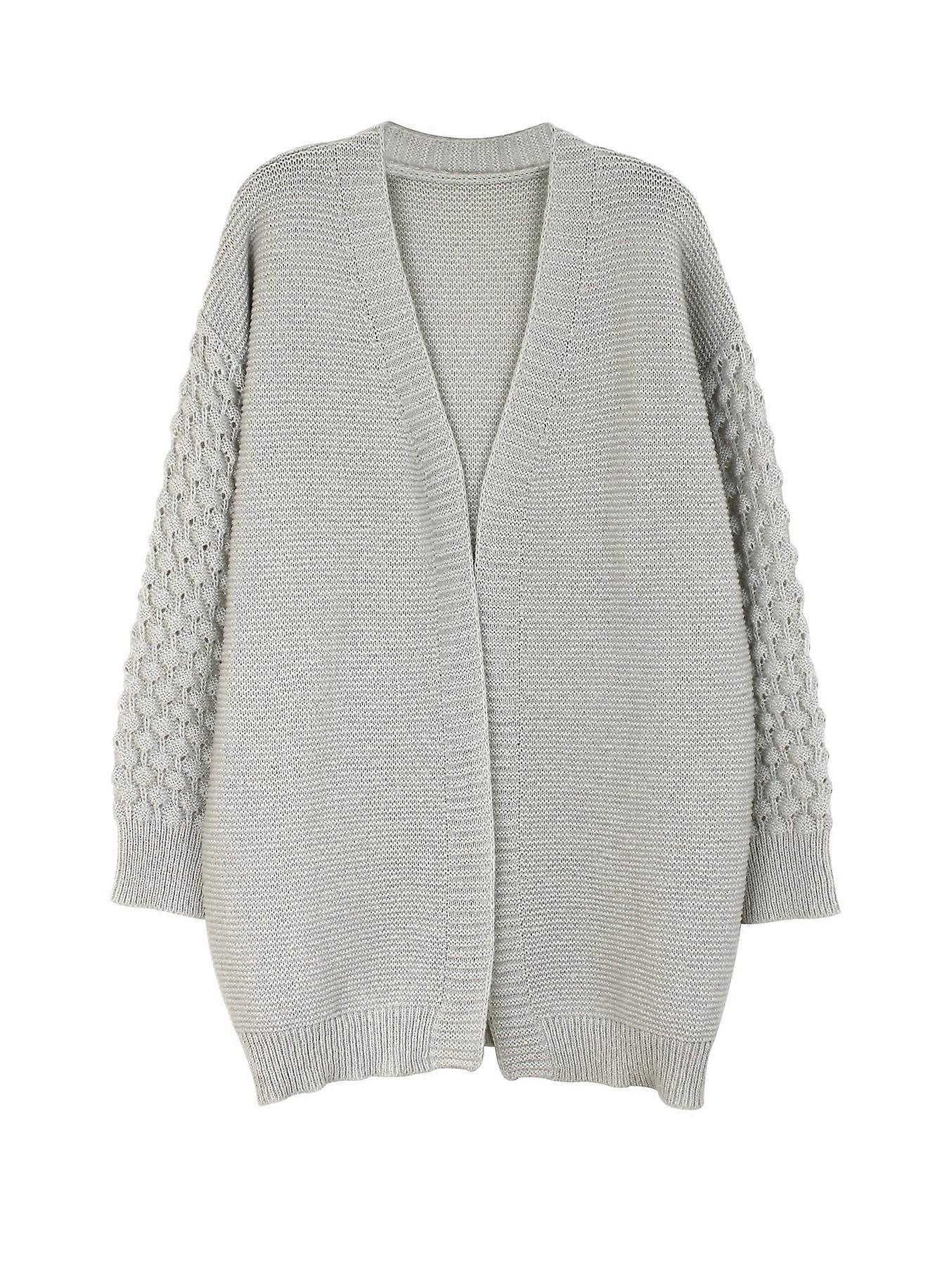 Fashionable Long Knit Coat in Black with Hollow-Out Design, Size M, Showcasing Unique Style and Artistic Flair