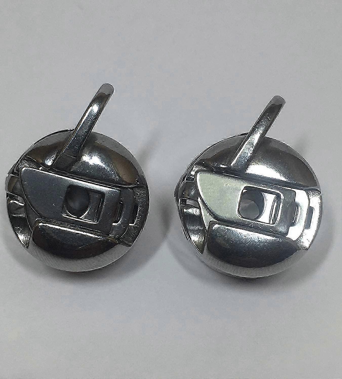 2 sewing machine bobbin cases compatible with front loading class 15 machines.