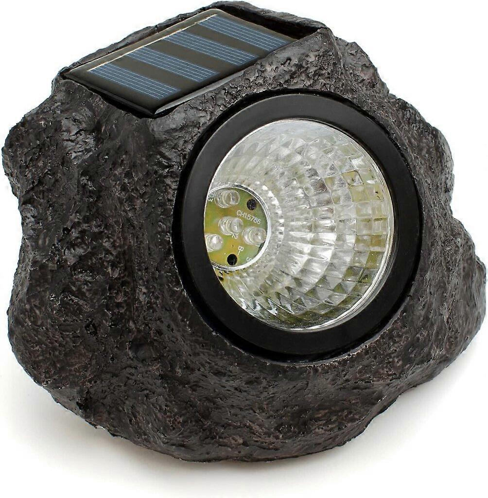 Rock shaped outdoor light with solar panel. Decorative