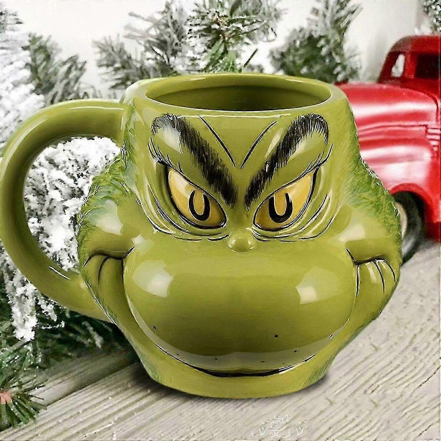 Festlig Grinchen-julmugg för högtidsfester och presenter