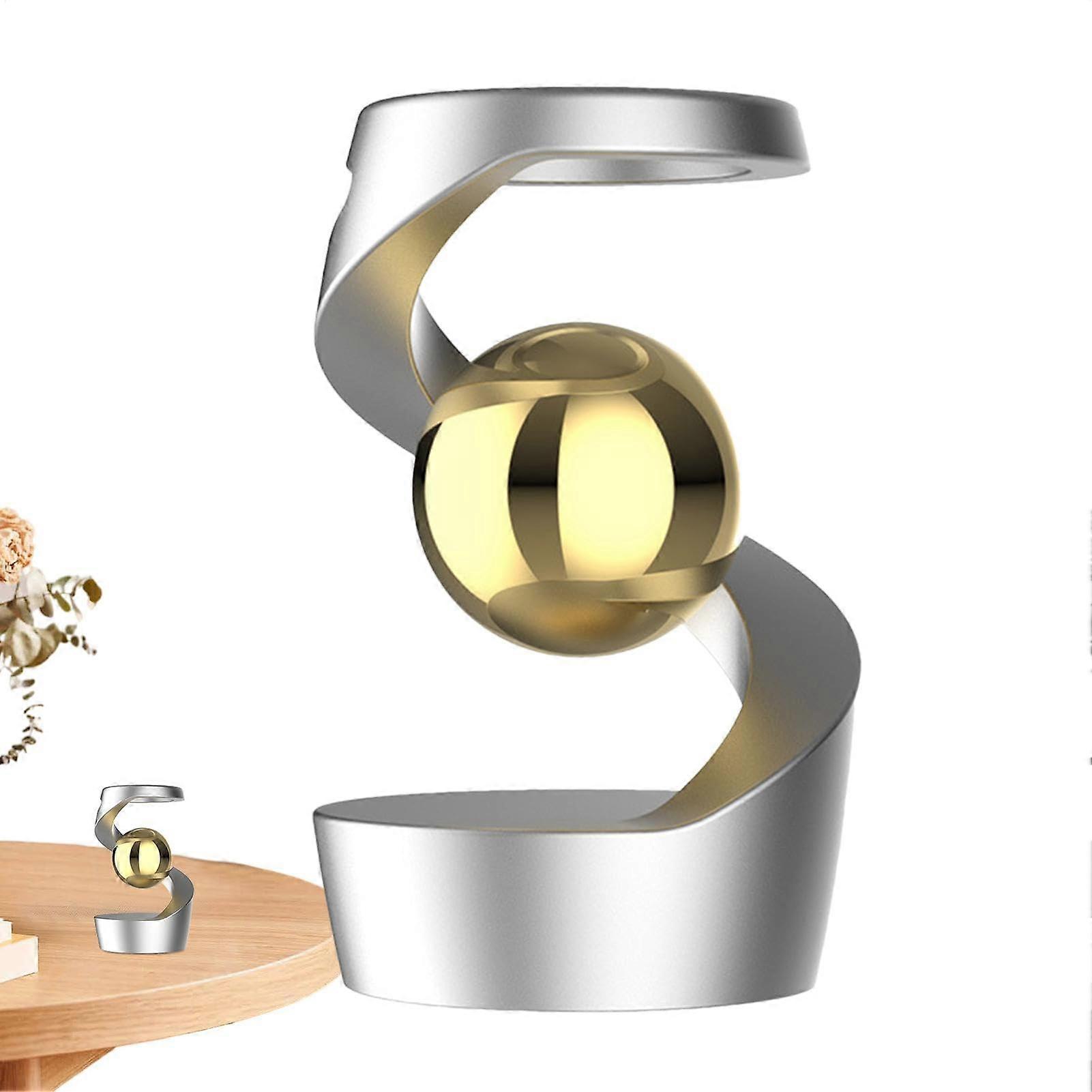 Gravity-defying kinetic desk toy Optical Illusion Desktop Sculpture With Silver Finish And Gold Beads