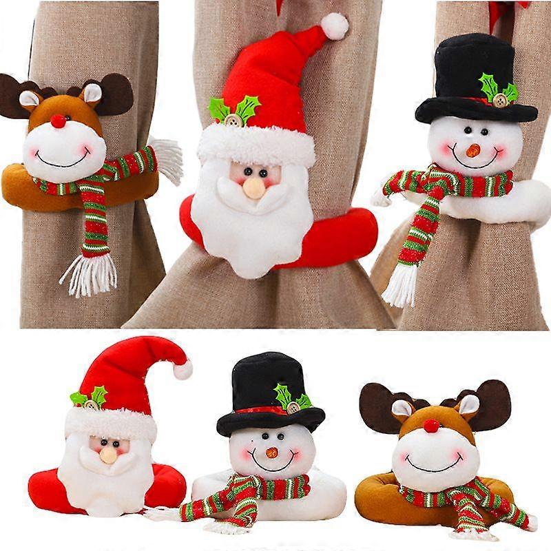 Set of 3 Christmas curtain clips with Santa Claus and snowman design.