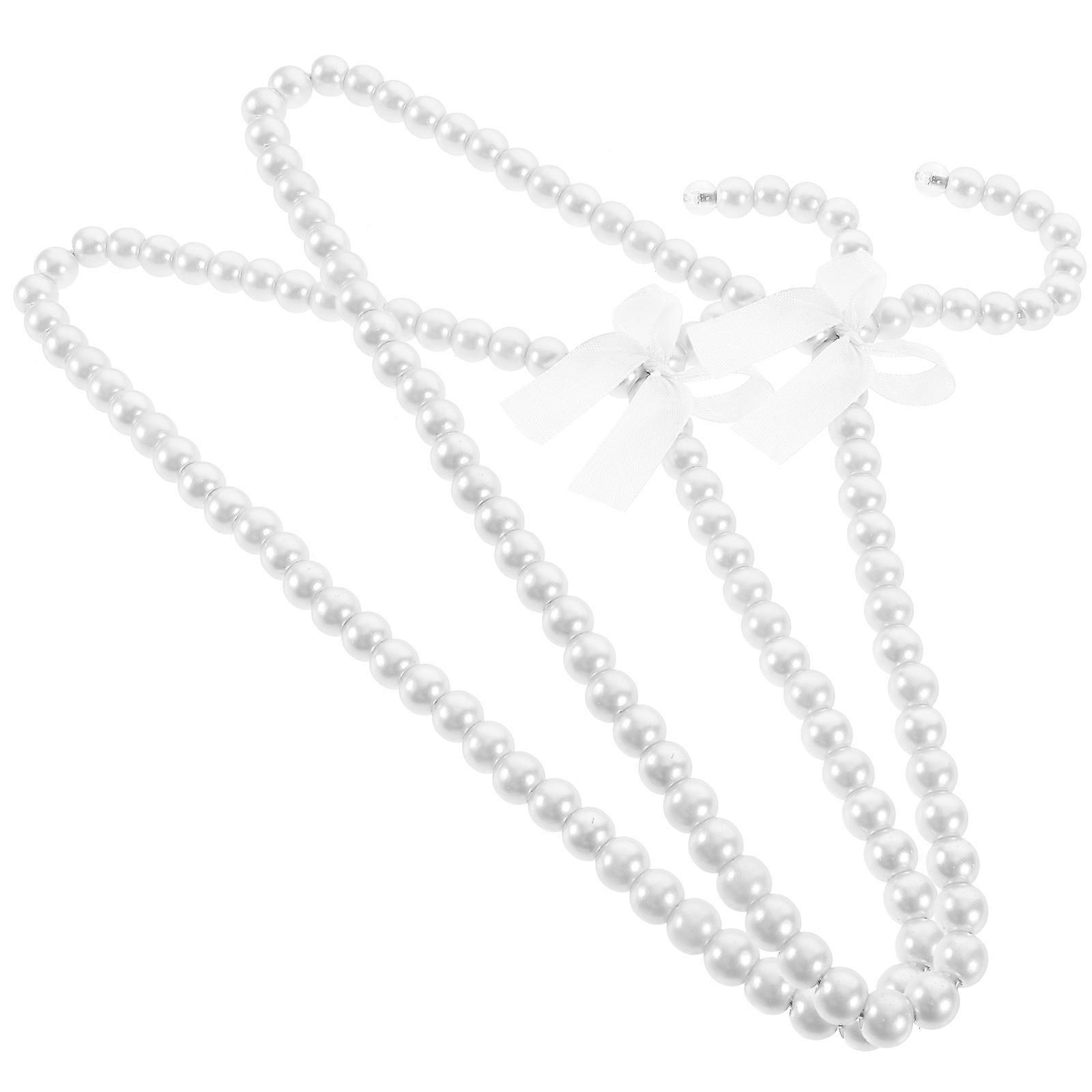 Petits cintres à perles, 2 cintres en ABS