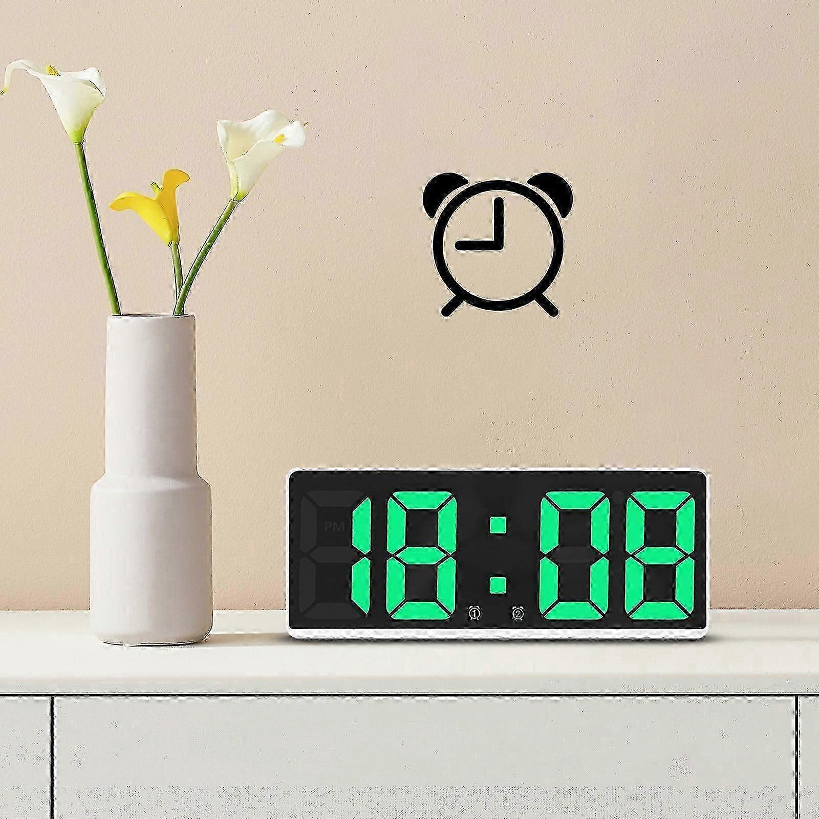 Black, high-tech digital alarm clock features a large LED display, kitchens