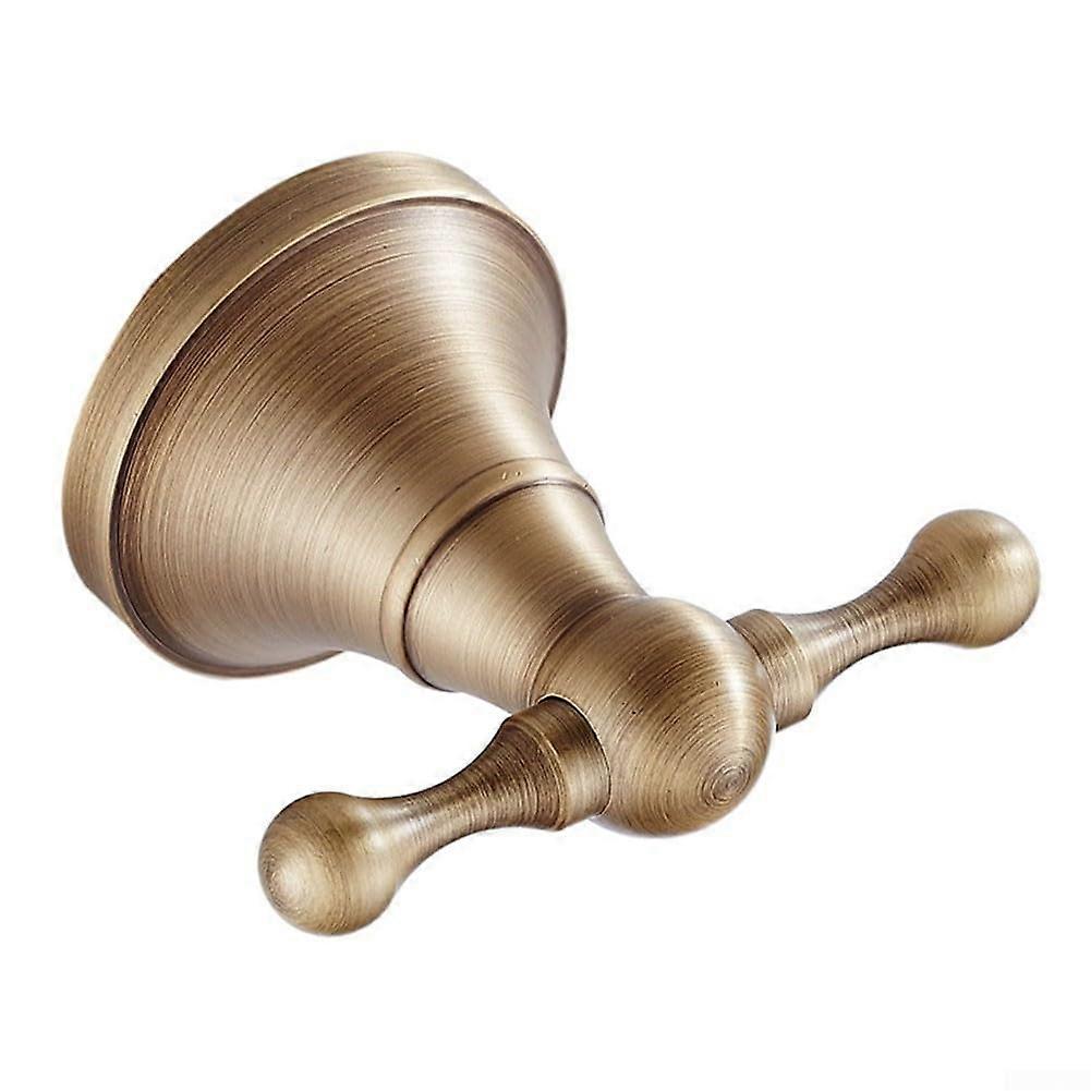 Antiquestyle brass coat hooks with singlehook design, a sturdy and practical hanging solution for bath towels, hallway jackets, and entryway bags.