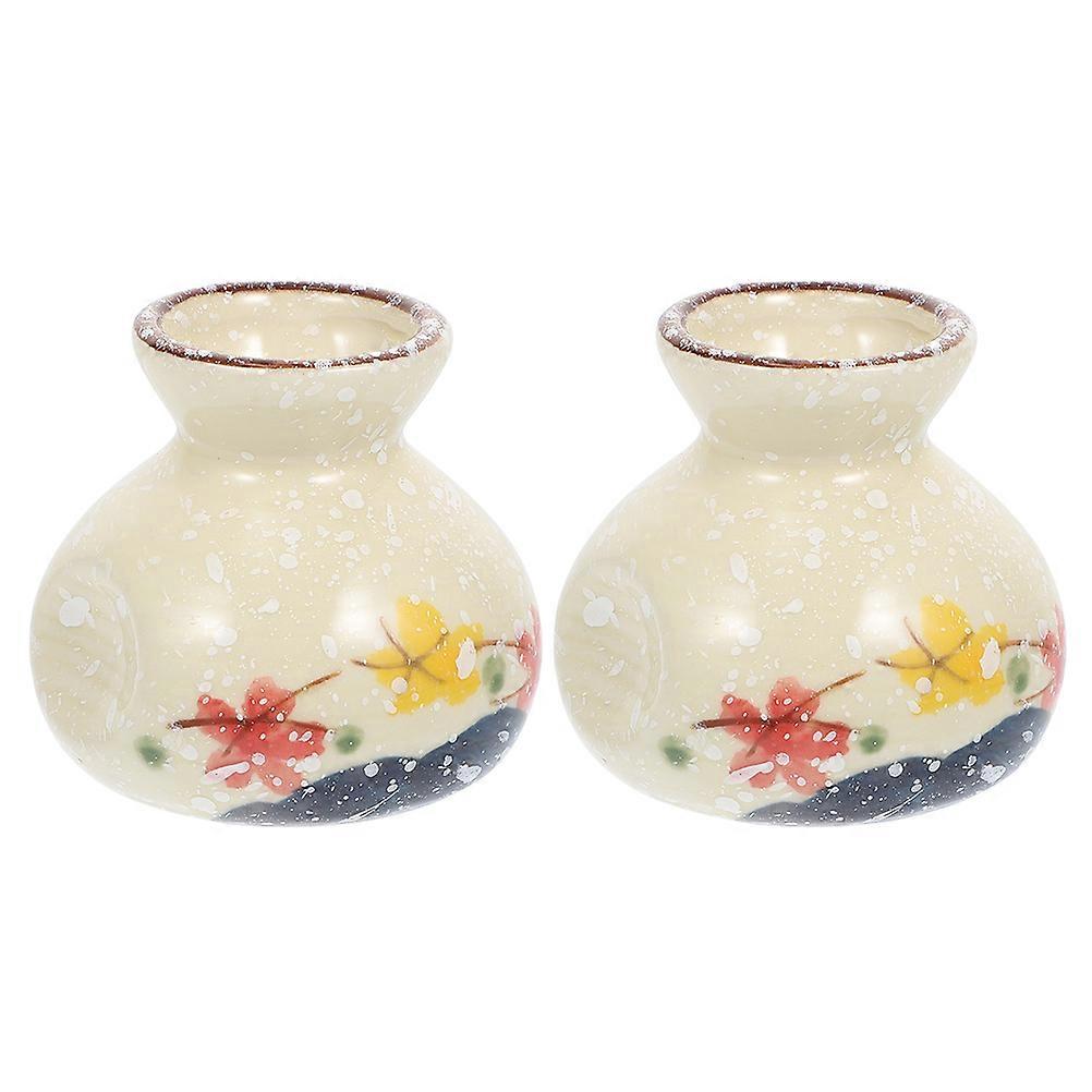 Here's a refined and engaging product description for your item:
**2pcs Mini Flower Vases – Retro Toothpick Holders with Stable Wide Base –