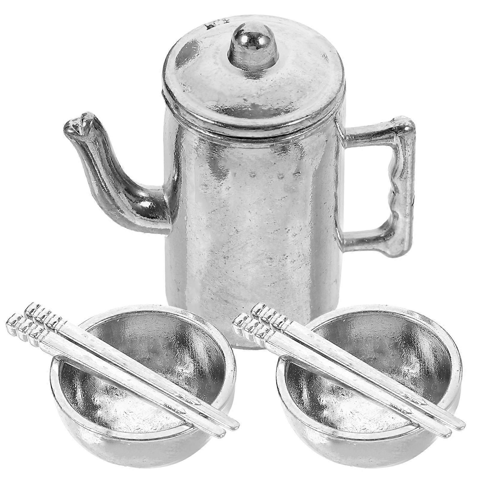 It sounds like you're describing a set of **miniature dollhouse tableware**, which includes tiny, realistic kitchen accessories such as: