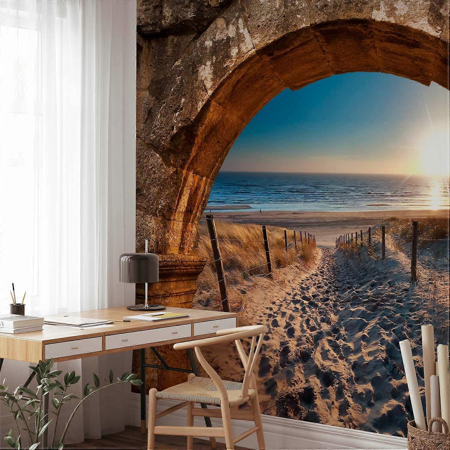 Fotobehang - Boog en strand