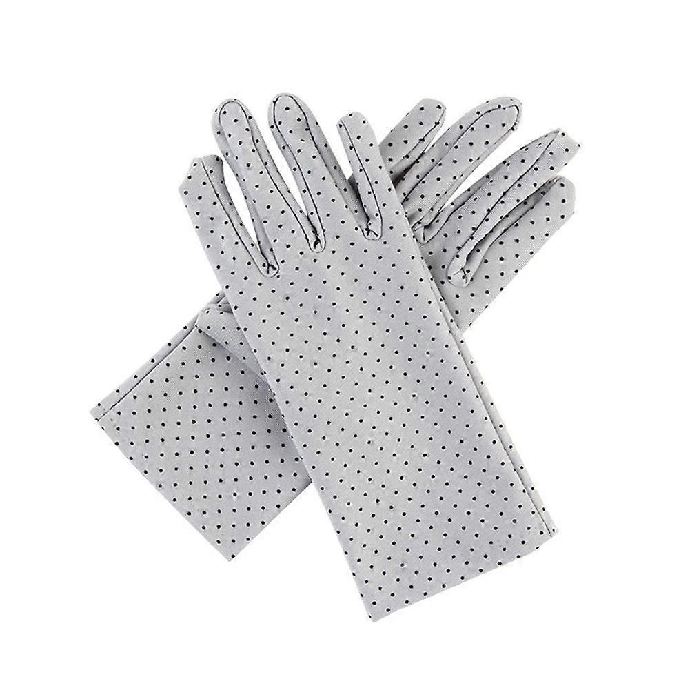 Luvas de sol de bolinhas, em elastano, modelo curto, com proteção UV e toque elegante.