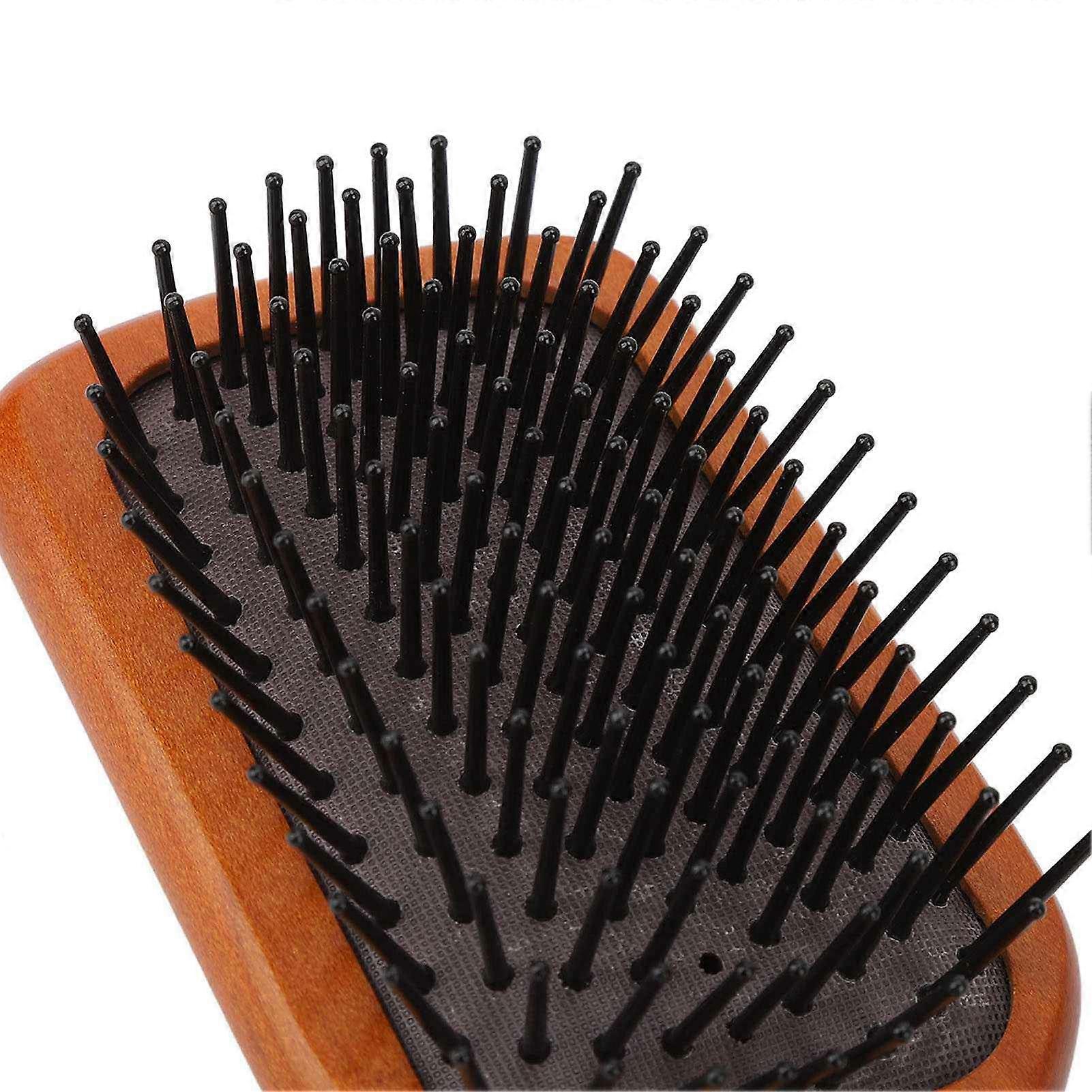 Ergonomic hairbrush for scalp massage, reduces tugging and prevents slipping. Detangling brush with handle for women.