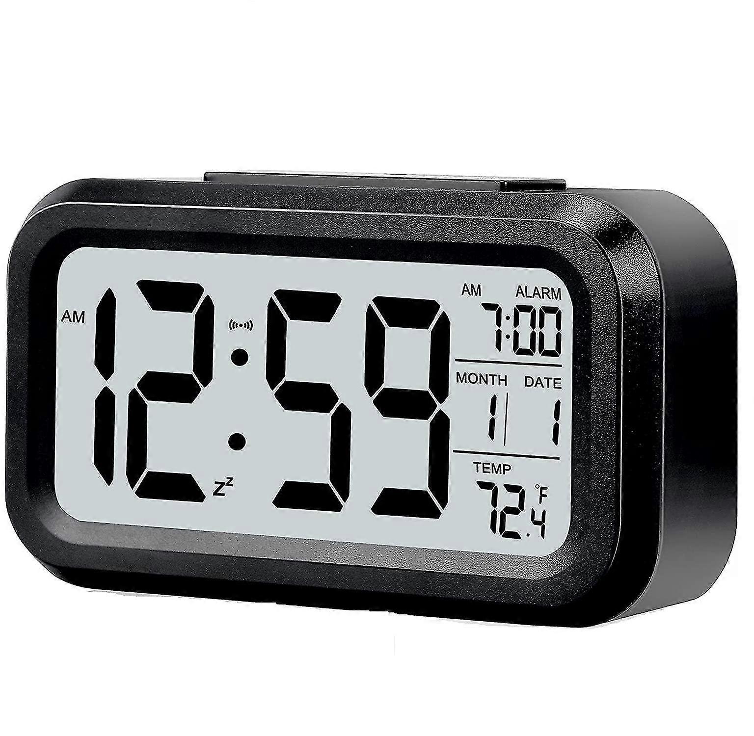 Digital alarm clock with smart night light