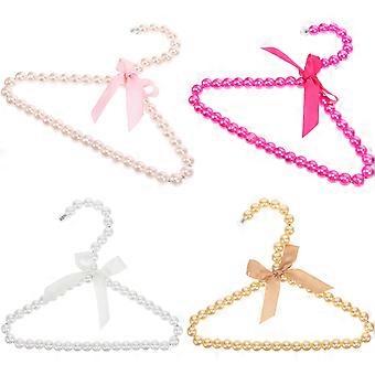 Set di 4 grucce in plastica a forma di perla per stendere i vestiti degli animali domestici.