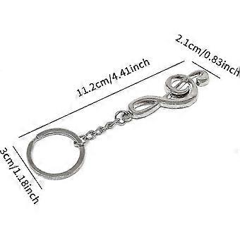 Conjunto de 6 chaveiros decorativos em metal com símbolos de notas musicais.