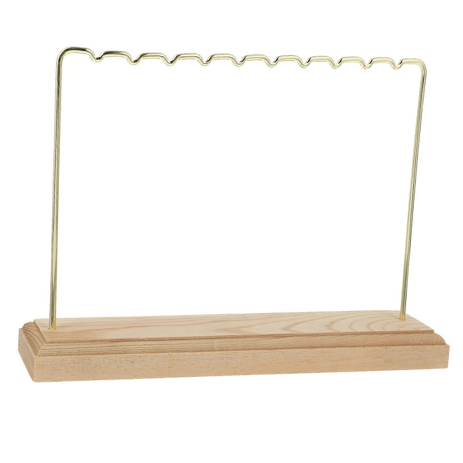 Here's a concise and compelling product description for a **Minimalist Earring Stand / Stylish Jewelry Organizer**:
**Minimalist Earring Stand –