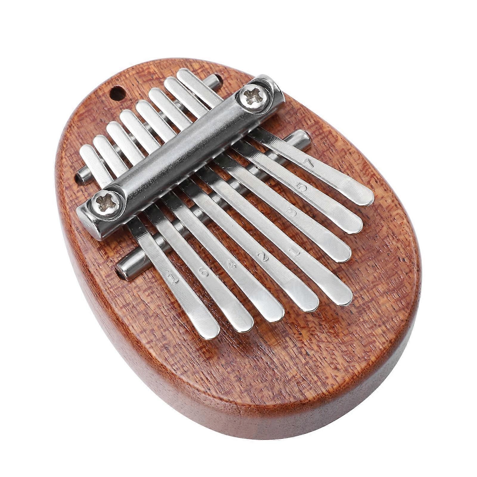 Brown Stainless Steel Thumb Piano with Eight Keys for Home Use Portable and Beginner Friendly Musical Instrument