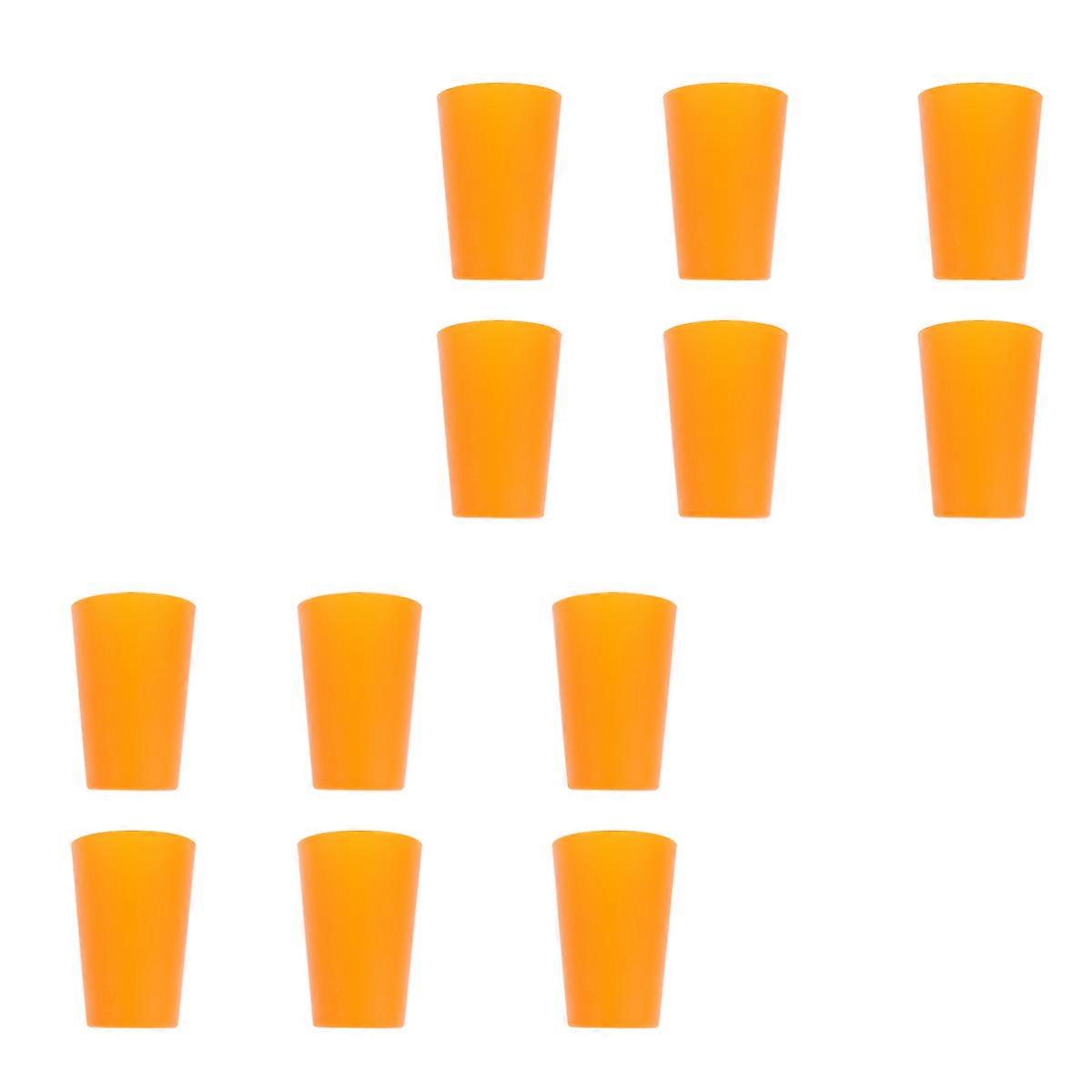 12db műanyag gyümölcslé csésze vastagsággal a parti kellékekhez, narancssárga színben egymásra rakva