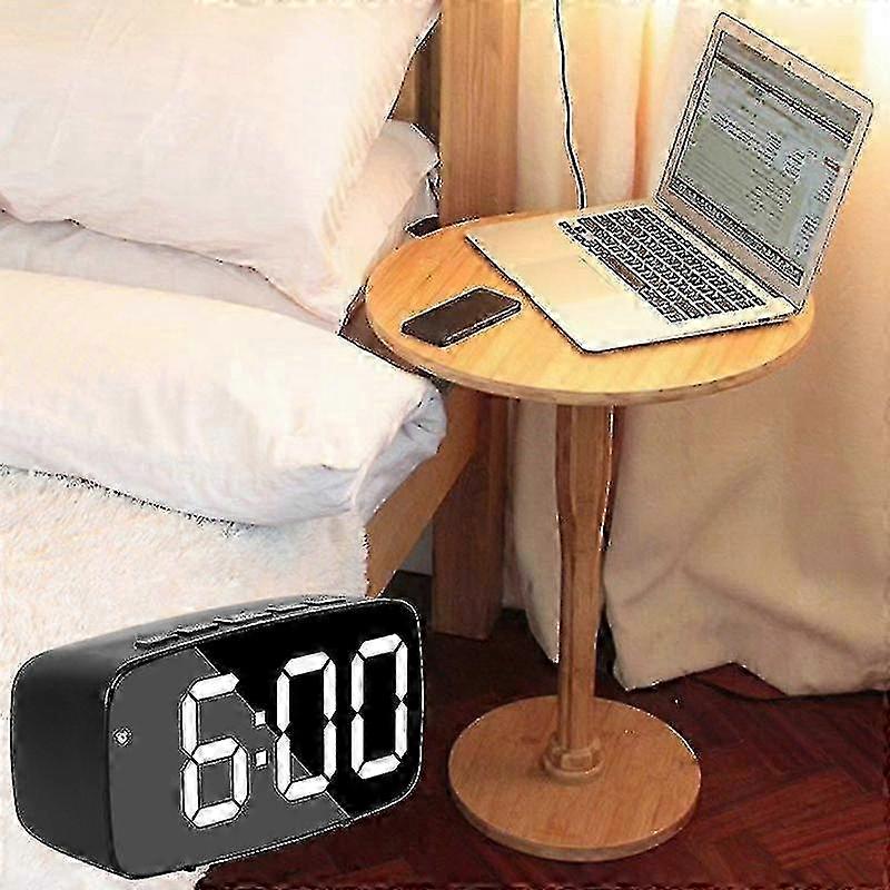 Smart digital bedside alarm clock, 12/24 hour format, automatic light adjustment, and snooze function.