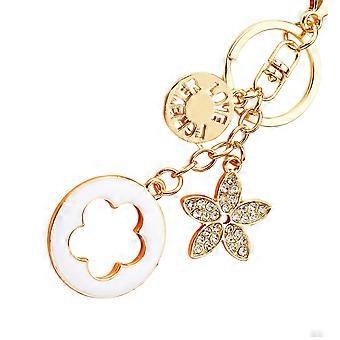 Llavero con colgante floral, cierre de mosquetón y anilla redonda para llaves o para decorar bolsos. Colgante floral en tono dorado con detalles en blanco.