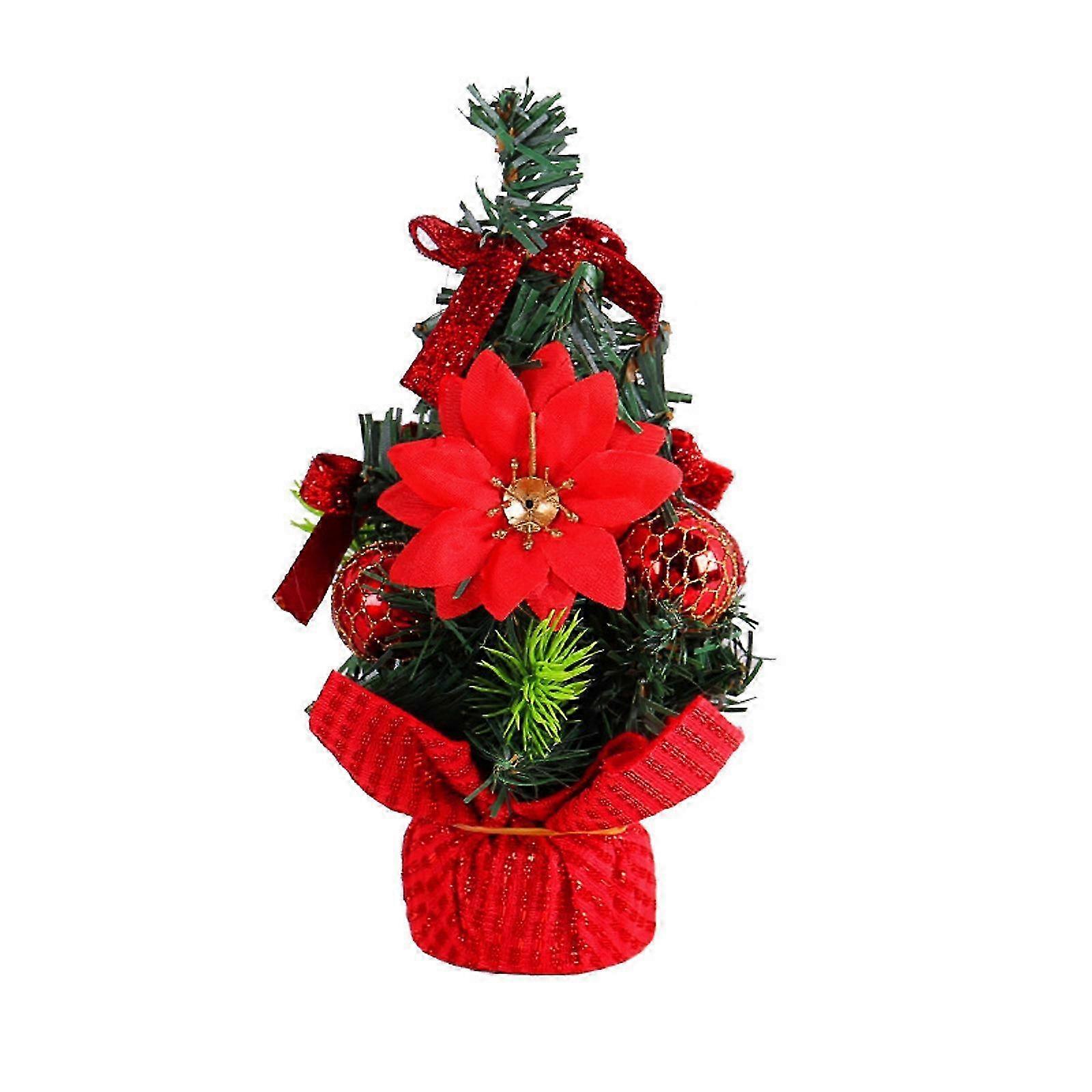Festive tabletop tree with red Christmas decorations and pine cones