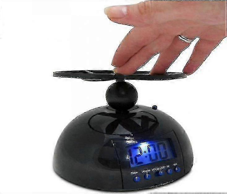 Alarm clock with flying feature and snooze button