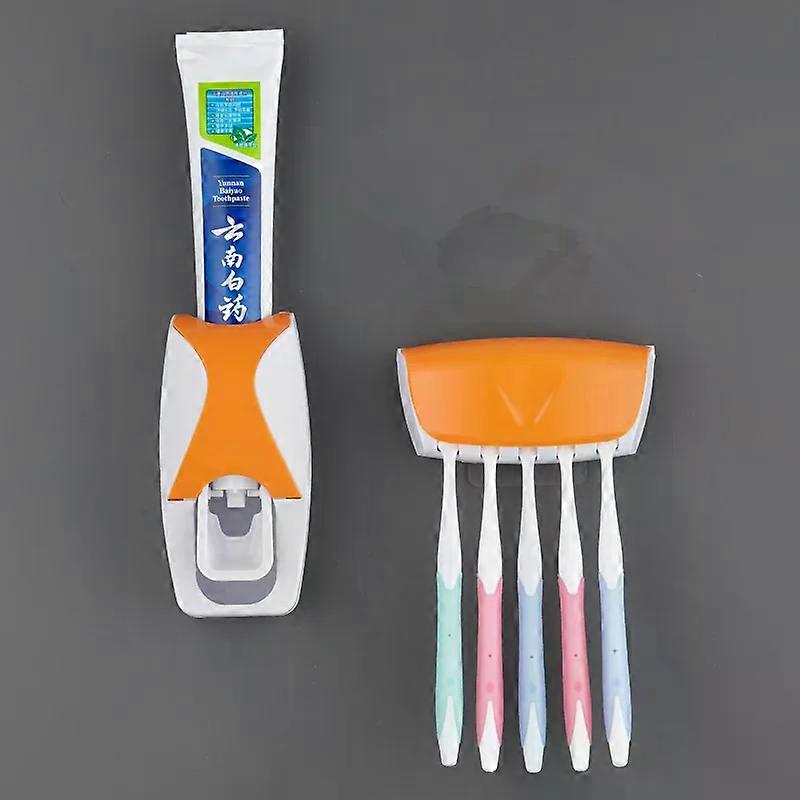 A wall mounted toothbrush holder with an automatic toothpaste dispenser and a bathroom toothpaste squeezer