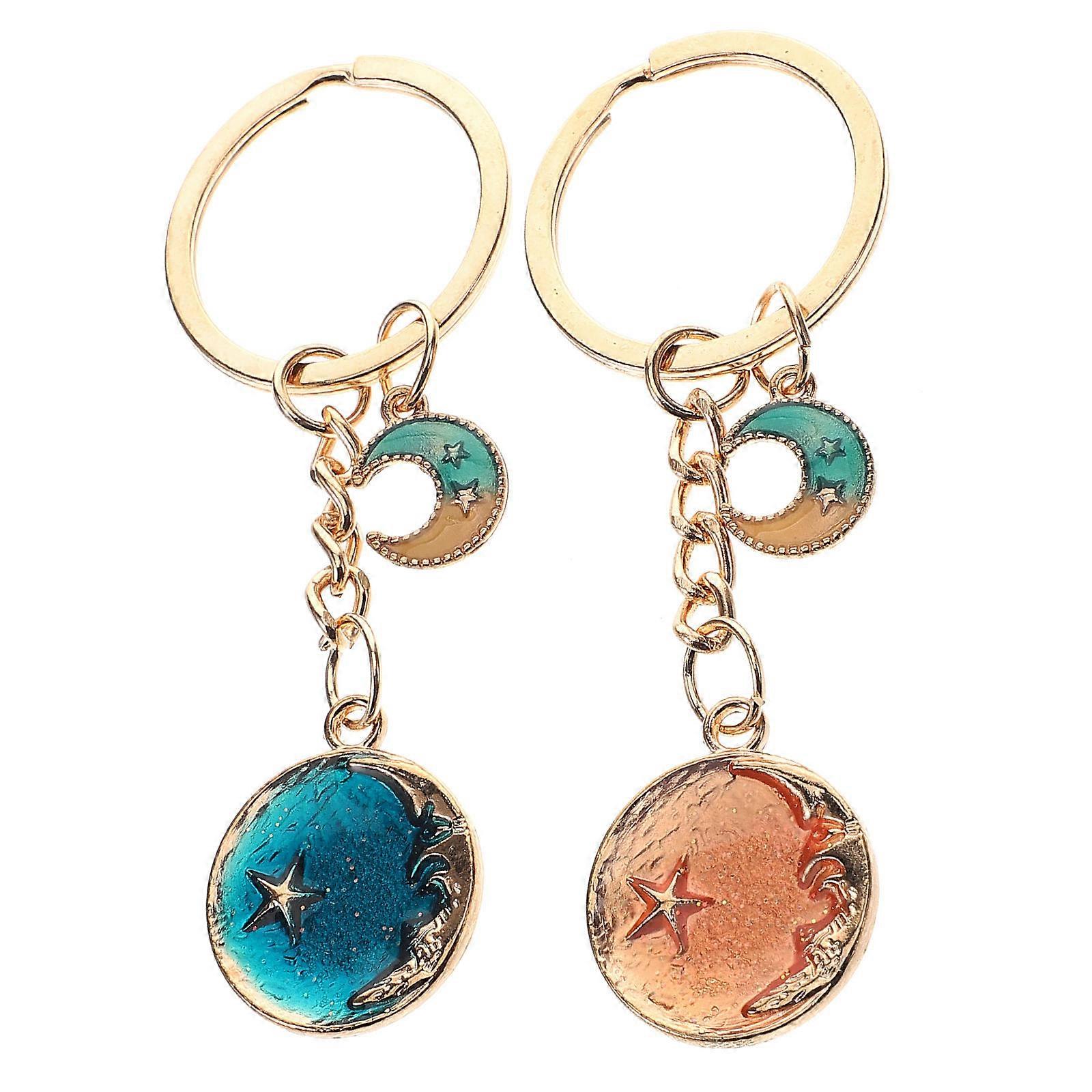 a refined product description for your keychain set:

 

**2pcs Cute Cartoon Star & Moon Keychain Set – Whimsical Metal Keyring for Couples, Friends