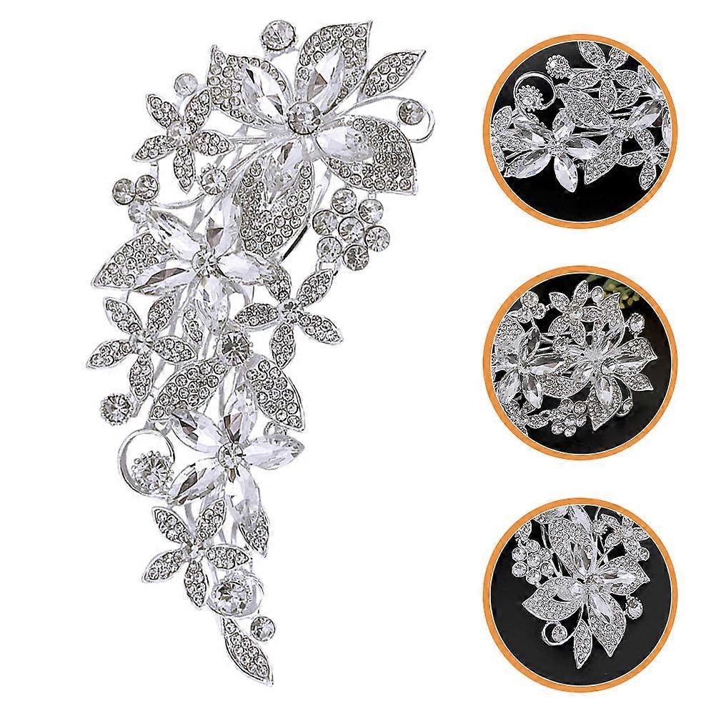 Pente de cabelo de noiva com strass e detalhe prateado.
