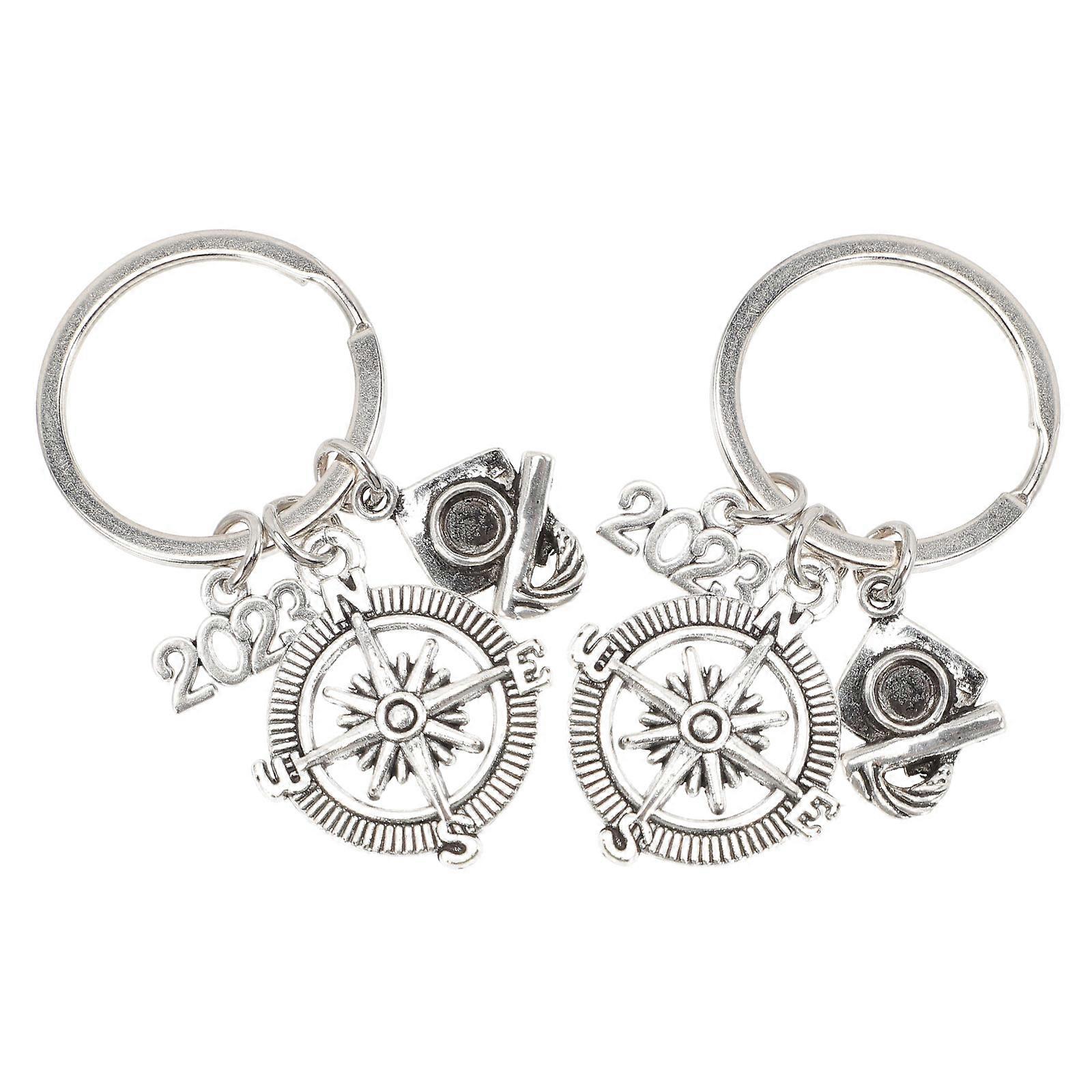 a polished product description based on your input:
**2pcs Graduation Themed Keychain Zinc Alloy Key Rings with Durable & Smooth Finish for Bags,