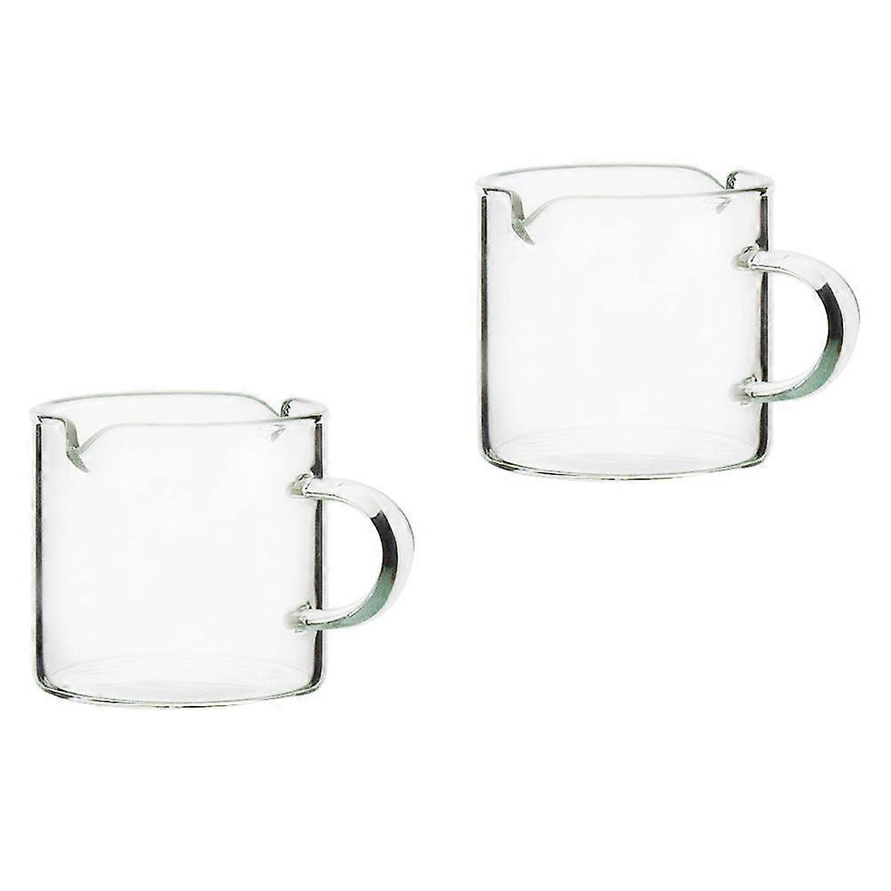 a polished and professional product description for your item:
**2pcs Creative Heat Resistant Milk Cups with V Shaped Pouring Spout – Transparent