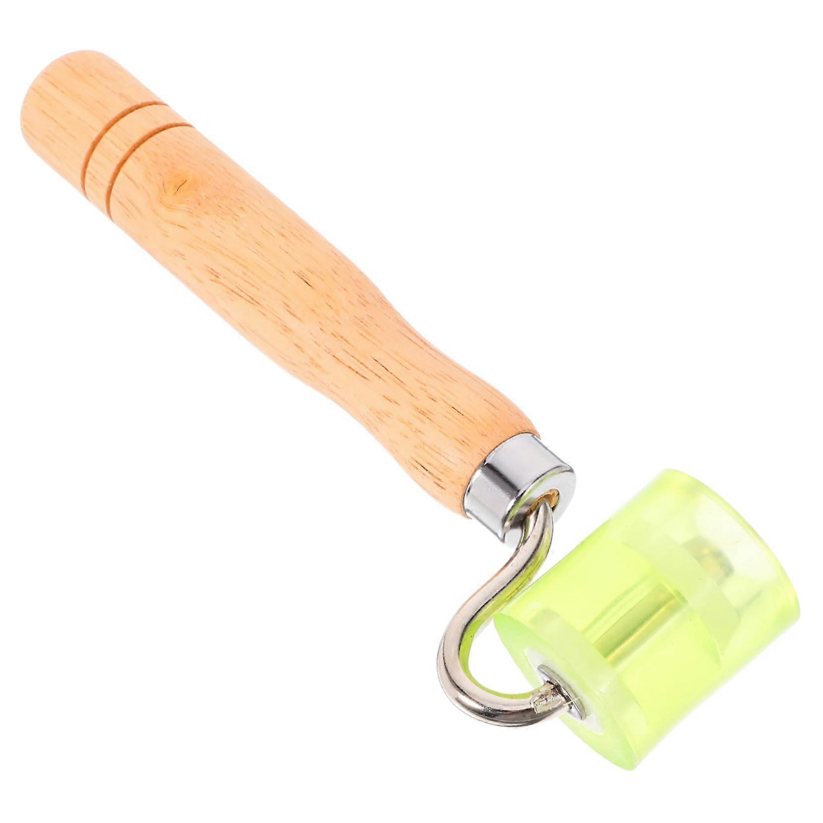 Multipurpose carpet seam roller for textiles, leather, and vinyl floors with wooden handle for durability.