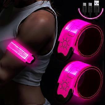 Twee oplaadbare LED-armbanden, USB-opladen, reflecterende LED-hardlooparmbanden en LED-veiligheidsarmbanden.