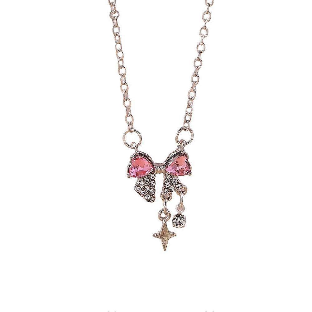 Collier avec pendentif croix en zircon rose et nœud papillon