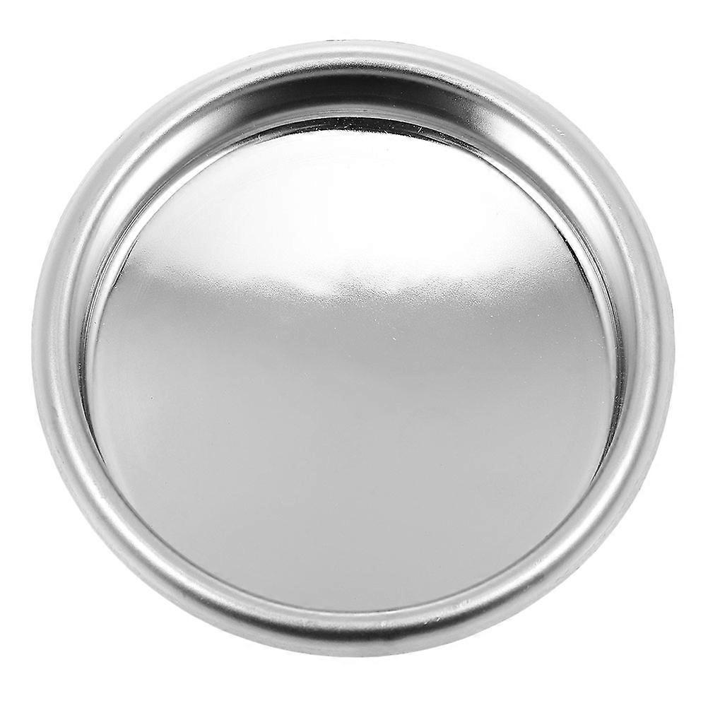 The **Metal Blind Filter for Semi Automatic Espresso Machines** is a and essential cleaning accessory designed to simplify maintenance, especially