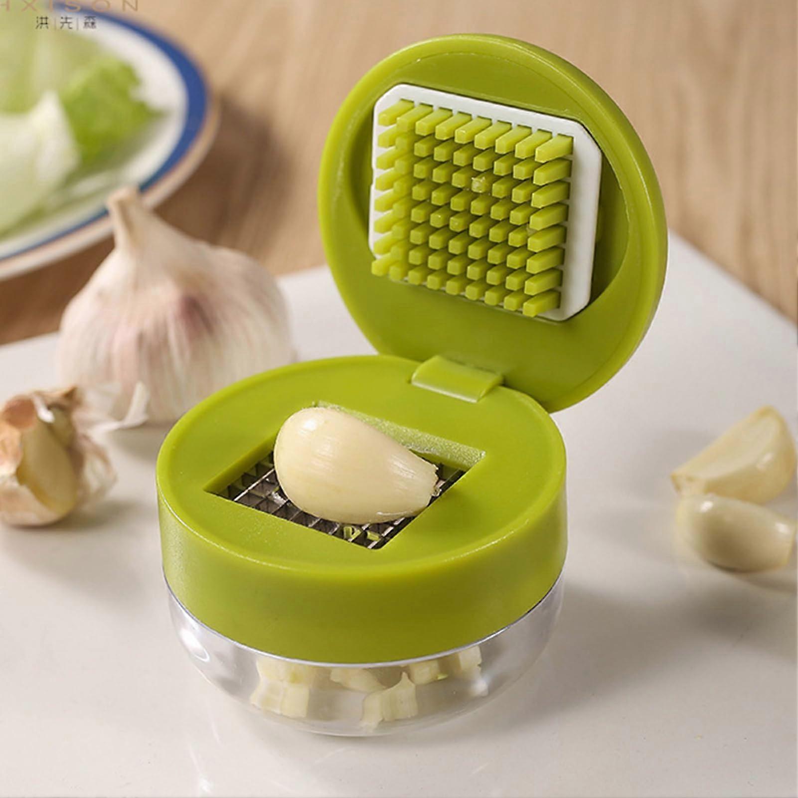Garlic Press with Storage Container  Stainless Steel Manual Vegetable Chopper for Kitchen Use