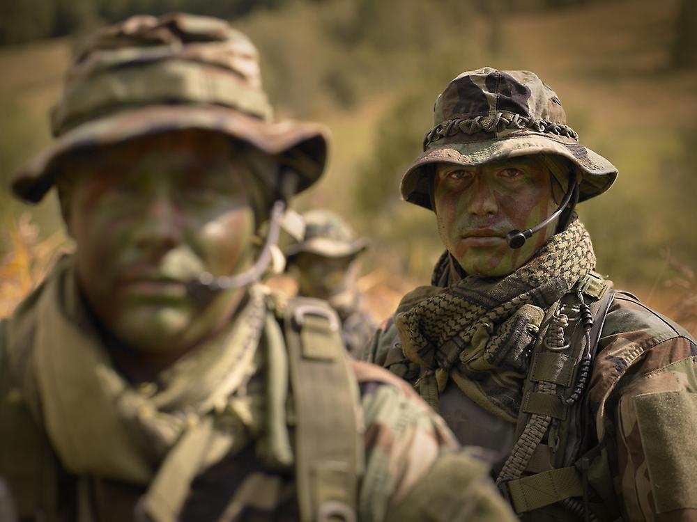 U.S. Navy SEALs during combat operations. Poster