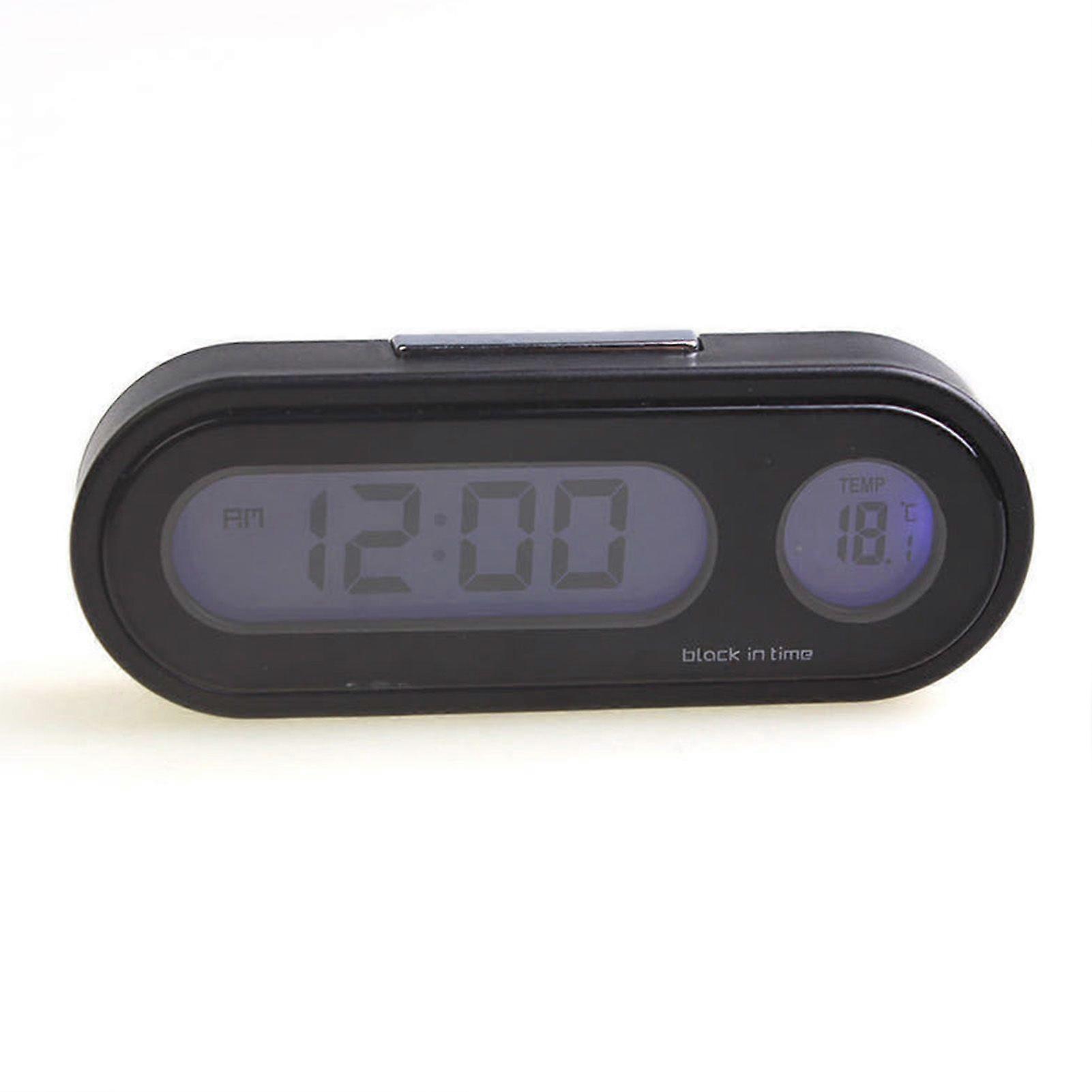 car dashboard clock with temperature and time