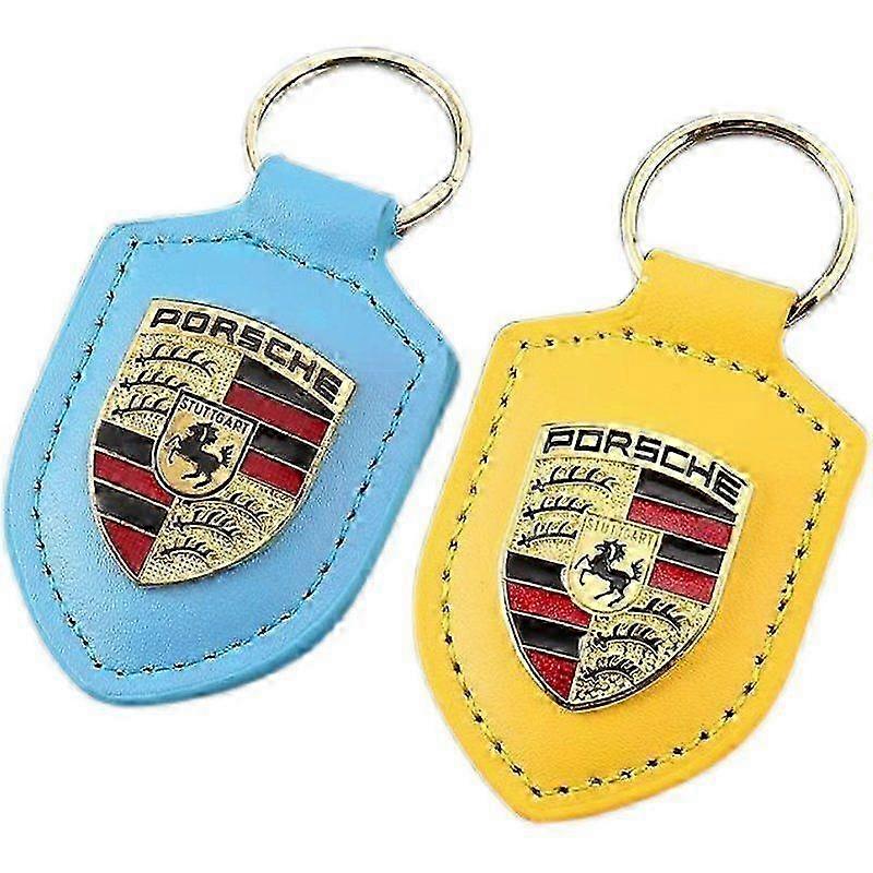 Two Porsche keychains, red and black combination keychains