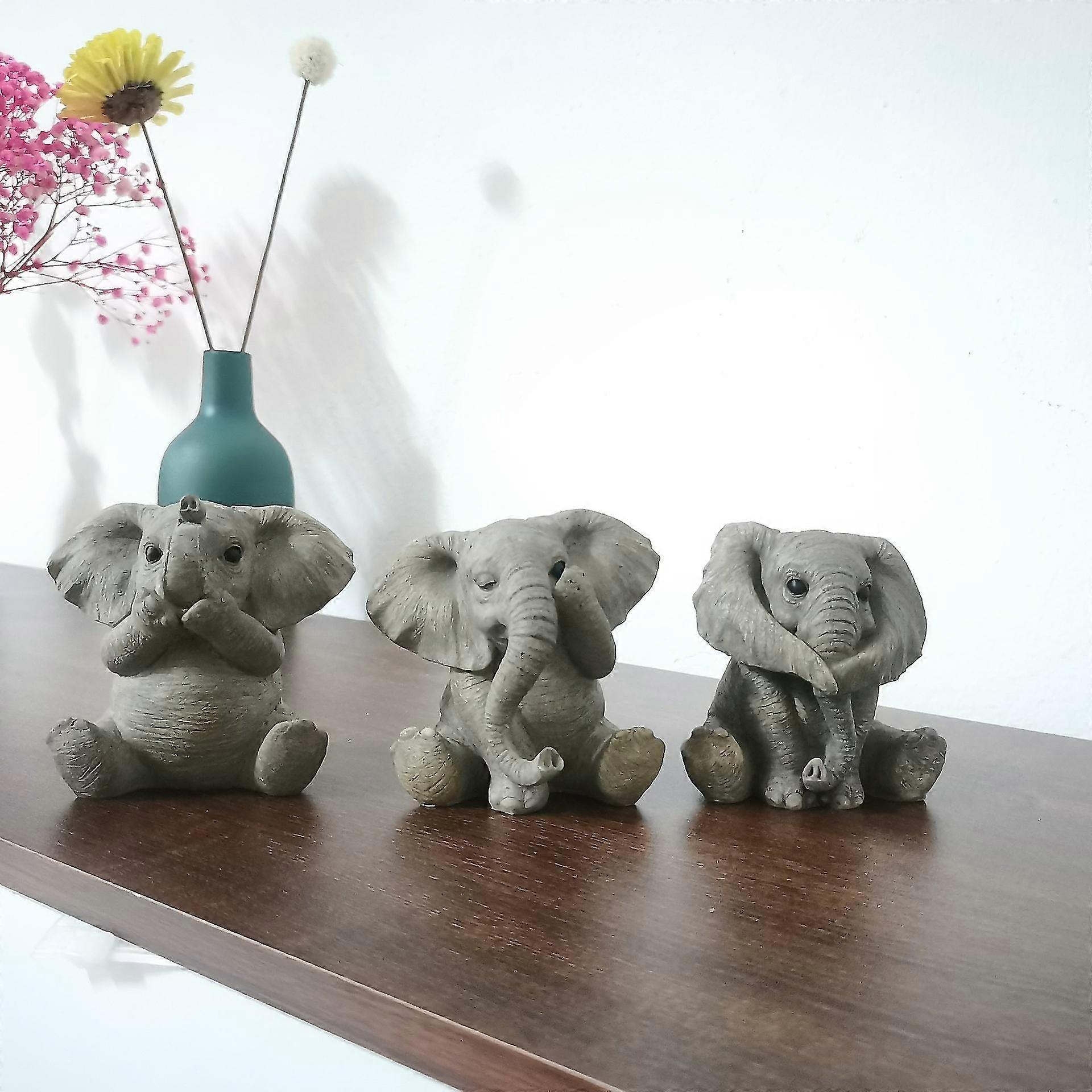 3 figurines grises de bébé éléphant