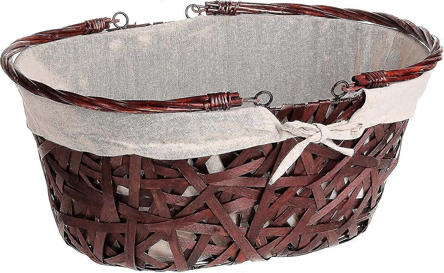 ベージュの生地、折りたたみ式ハンドルが付いている茶色の籐の大きいサイズの楕円形のバスケット