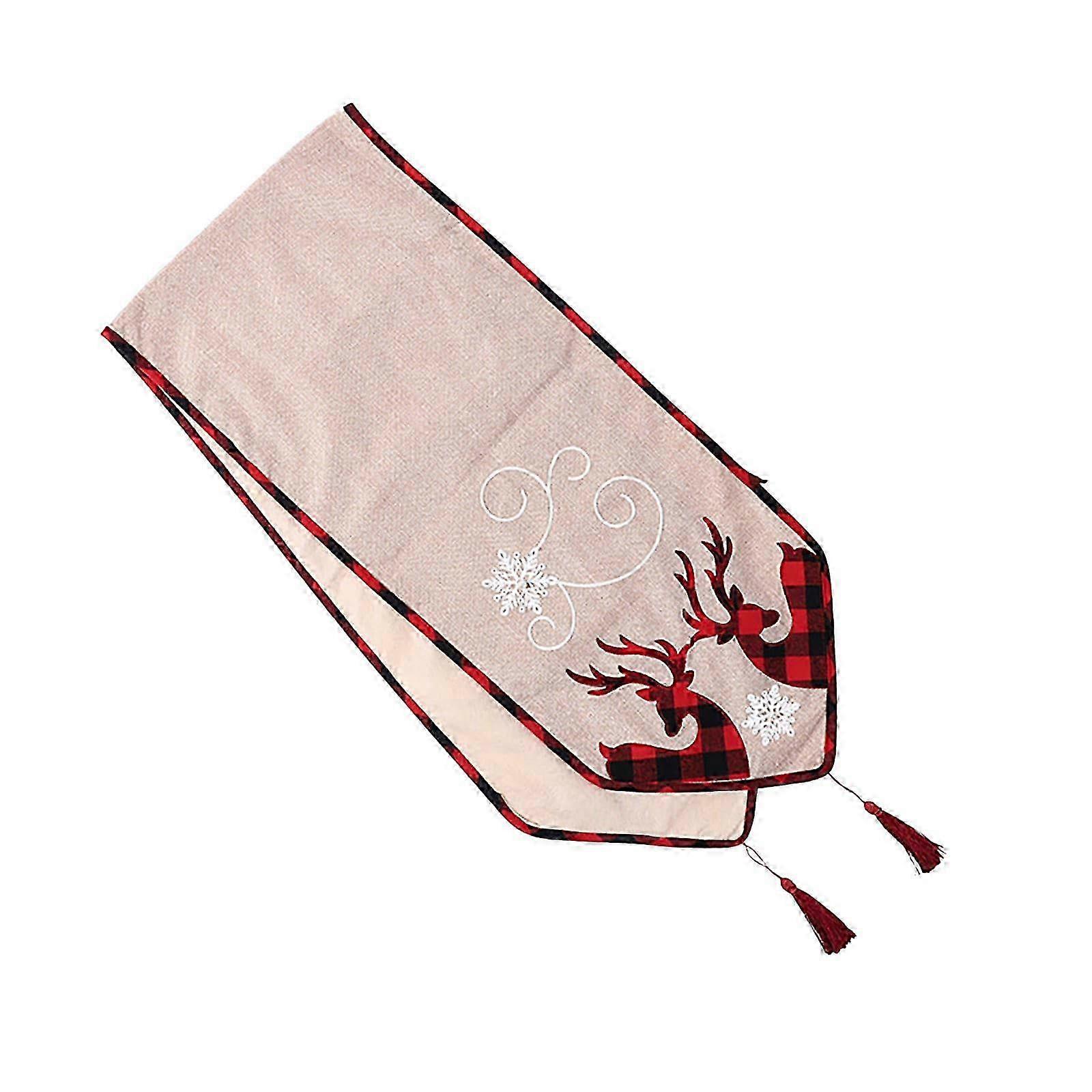 Festive table runner with deer motif for Christmas dinner party setting