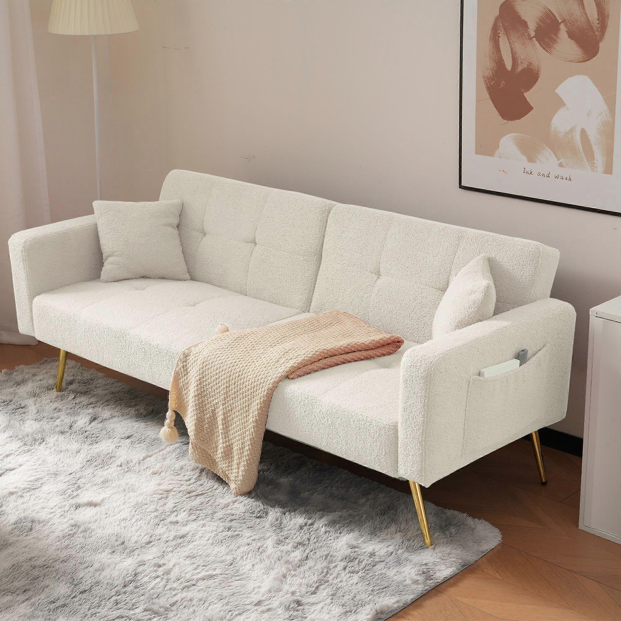 The sofa bed has a bed function, three adjustable backrest angles, gold legs, cushions and side storage pockets.