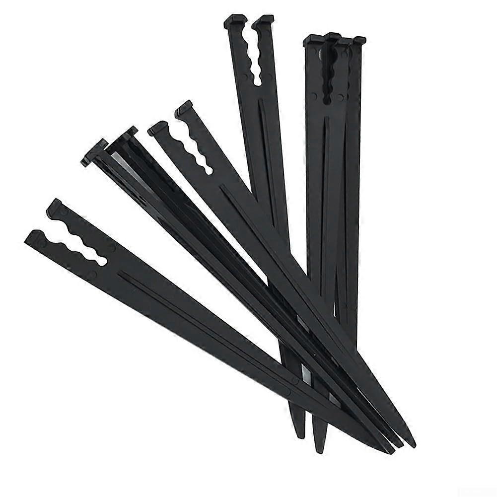 Durable plastic stakes for effective securing of drip irrigation systems in home gardens